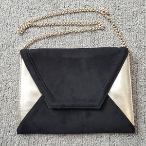 Express black and gold clutch with chain shoulder strap